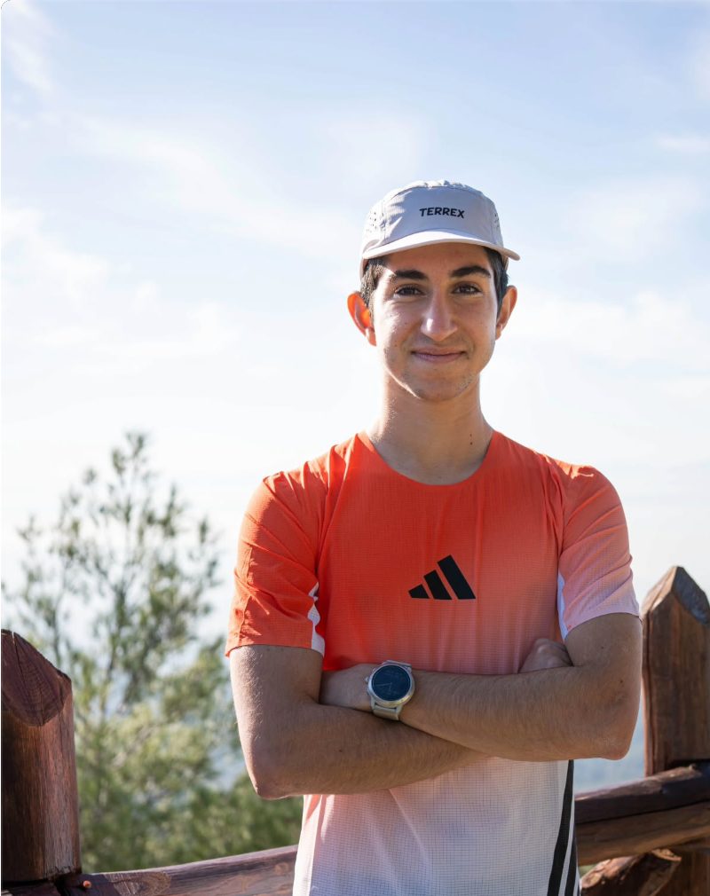 Konstantinos Paradeisopoulos wearing an adidas Terrex shirt and cap
